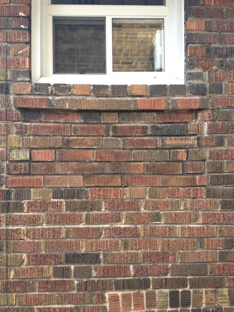 Same wall repaired below the window