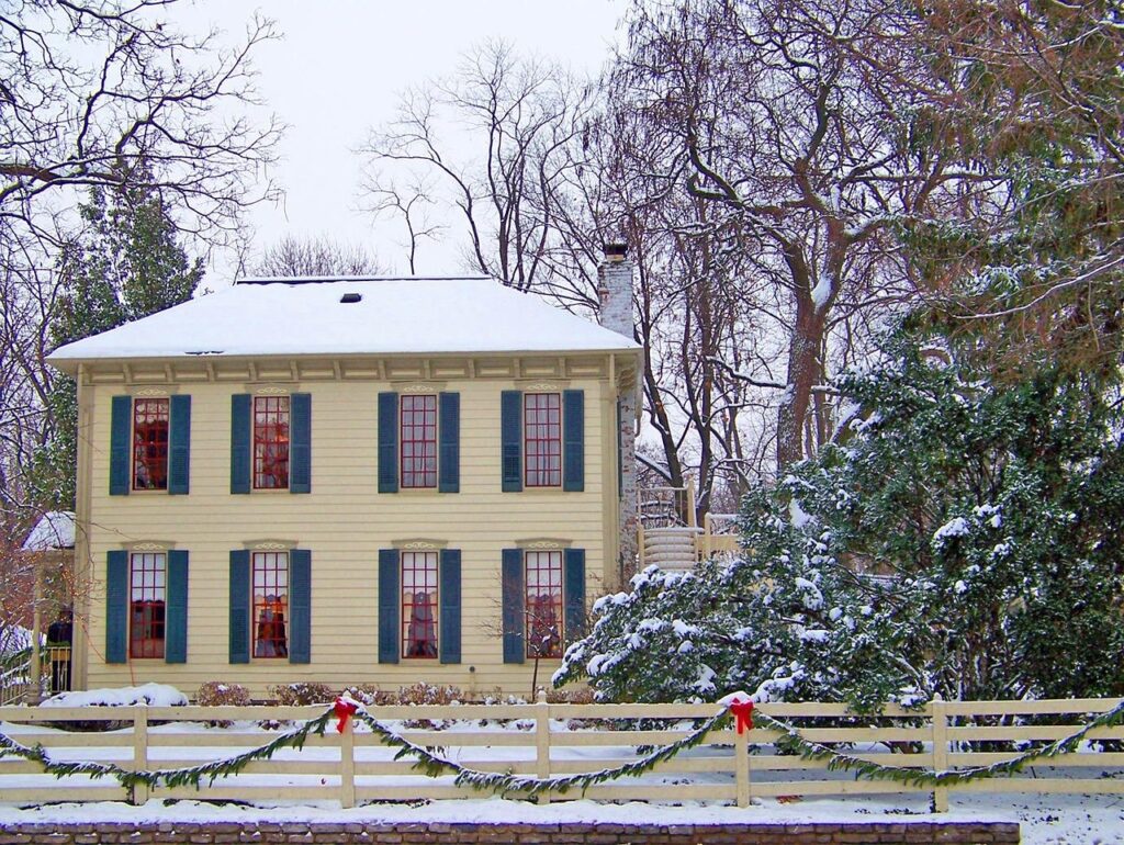 House decorated for Christmas in Snowy winter after chimney inspection GTA