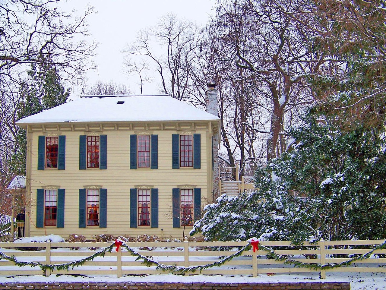 House decorated for Christmas in Snowy winter after chimney inspection GTA